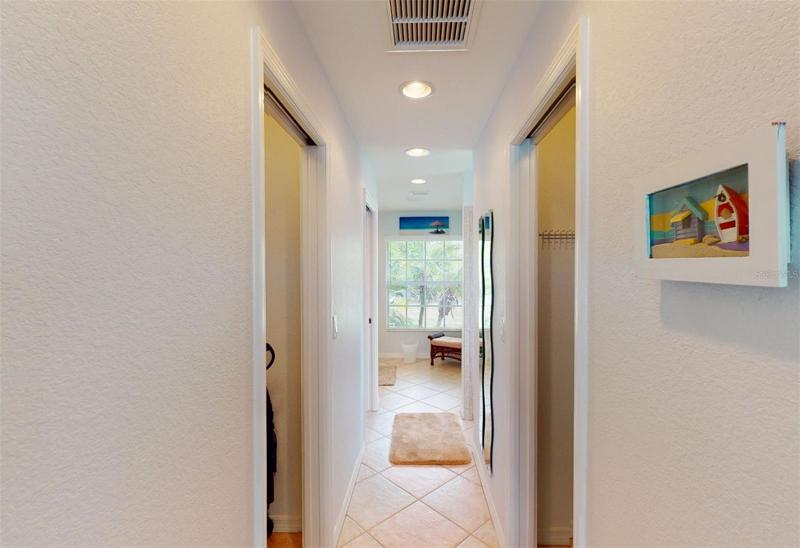 Hallway from Master bedroom to en-suite bath with 2 walk-in closets