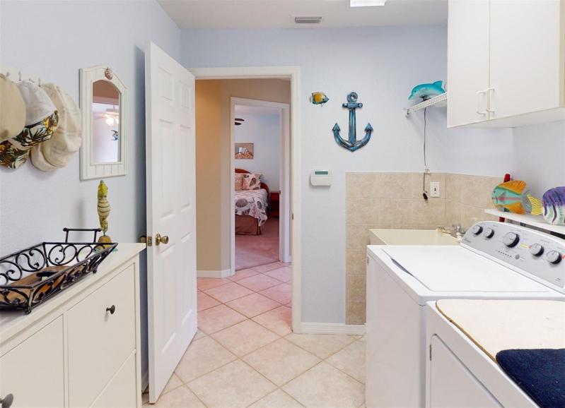 Large laundry room includes washer & dryer