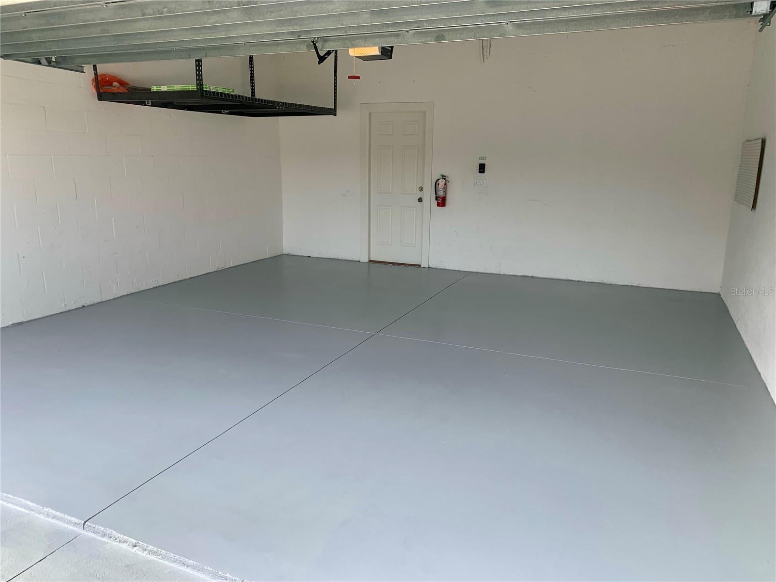 Spacious Garage with Suspended Storage Racks