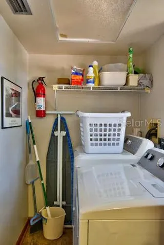 Laundry room with full size washer dryer