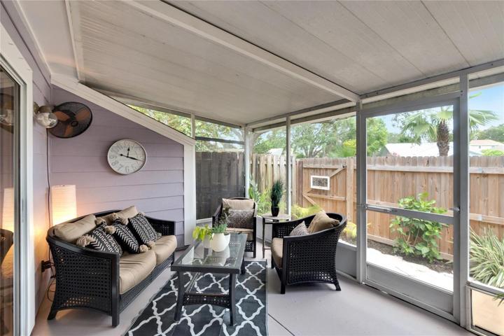 Screened patio with outdoor fan.