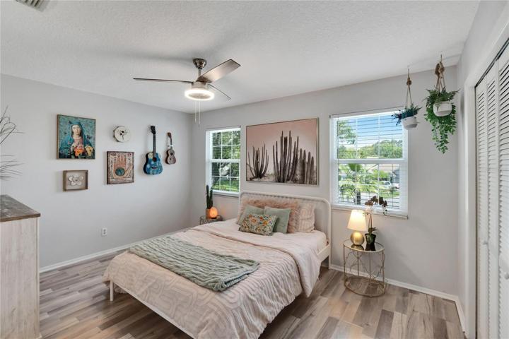 Bedroom 1, engineered hardwood floors.