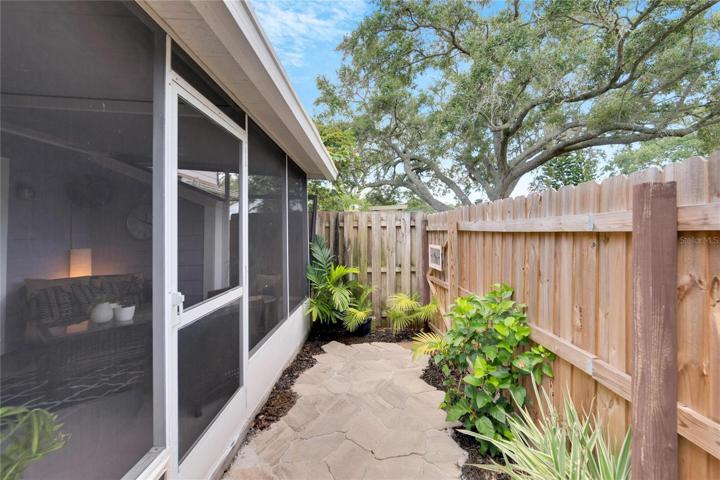 Small, maintenance free back yard with dog door.