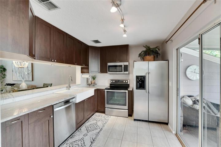 Gorgeous kitchen with stainless appliances.