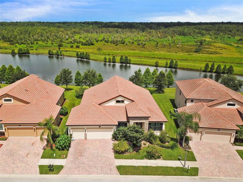 This spacious 4 bedroom, 3 full bath home has a TILE ROOF, NEW WINDOWS, a bright open concept floor plan under high ceilings and POND/NATURE PRESERVE VIEWS!