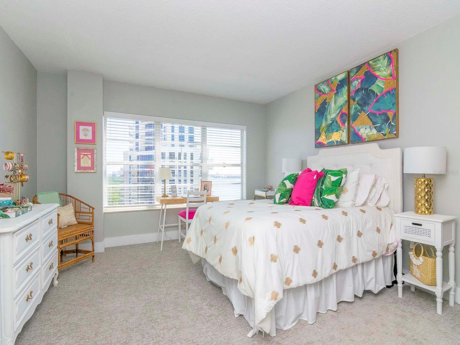 Relax in your bedroom while enjoying views from the 14th floor.
