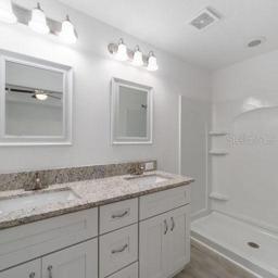 master bathroom, double sink and separate door to bathroom