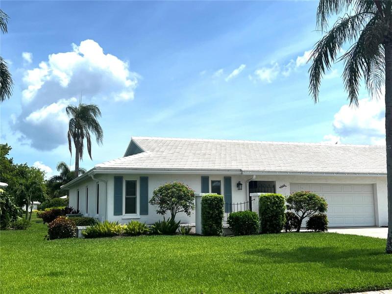 Two bedroom, 2 bath, 2 car garage villa in Village Green; a 55+ community.
