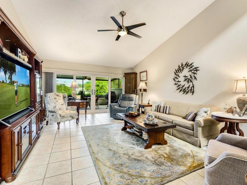 Great Room with vaulted ceiling, contemporary fan with light & tile floors