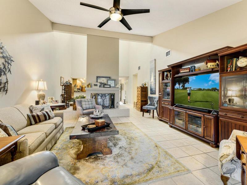 Great room defined by two sided fireplace.
