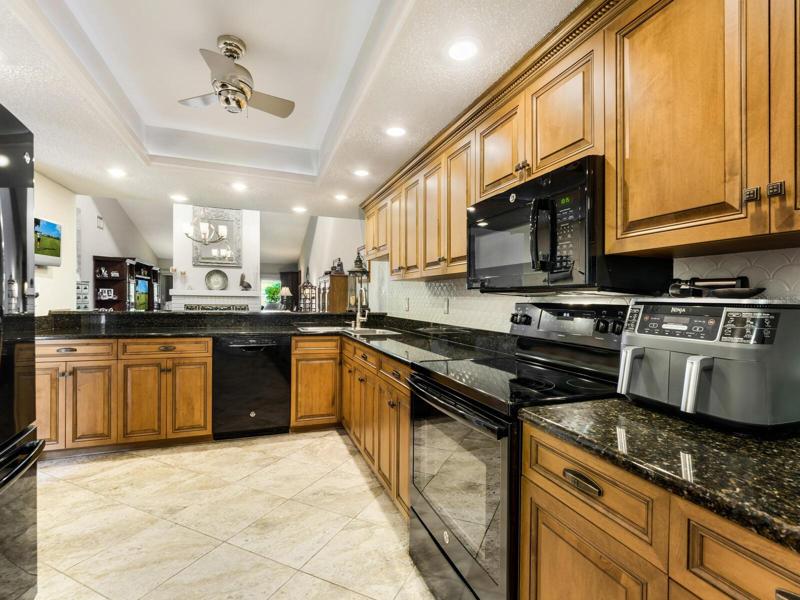 Tray ceiling with recessed lighting and fan & new good looking tile floors!