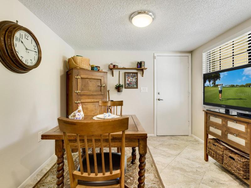 Breakfast room with large window with view of courtyard.