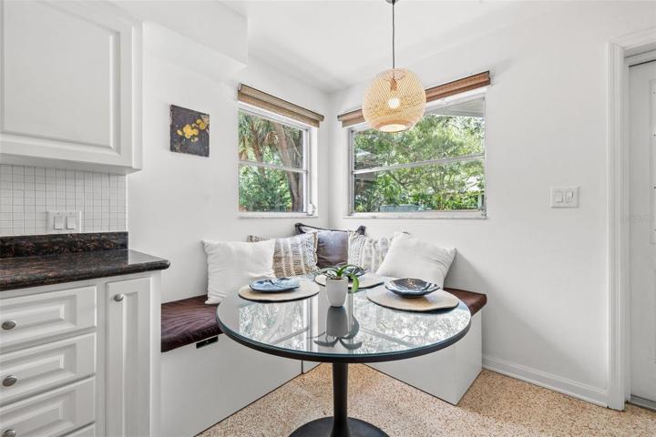 Cozy breakfast nook with so much natural light!