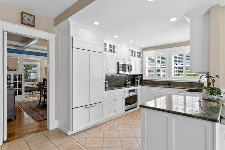 Kitchen area with entrance to formal dining room to the left.