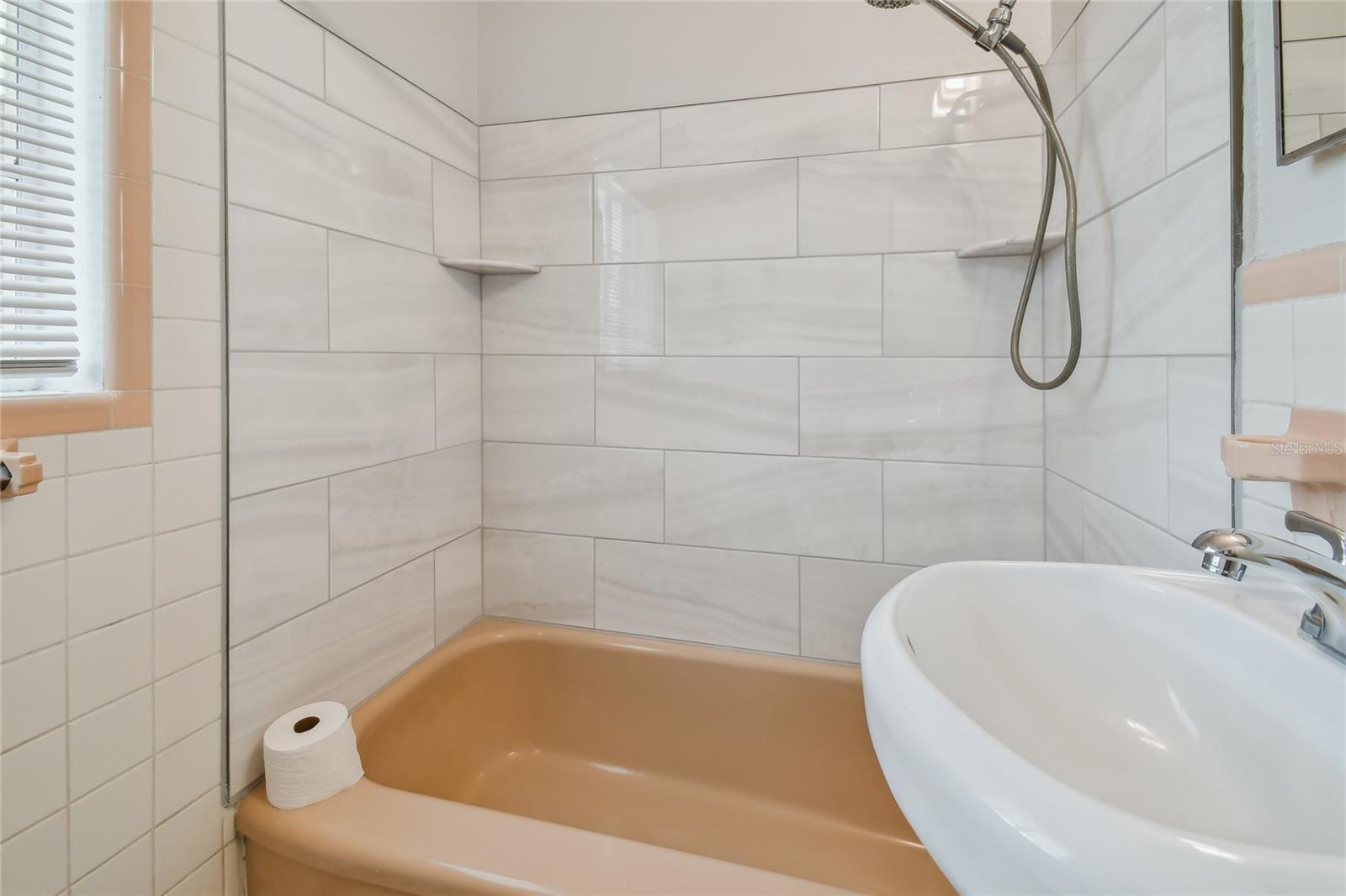 Bathroom with tub shower combo