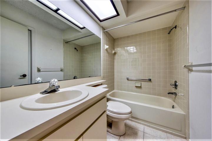 Guest bath has separate entrance directly to guest bedroom