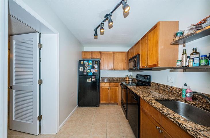 KITCHEN- Louvered Door Leads into Vanity/Bath Area for Guests. Huge plus! Guests Do NOT Have to Walk Thru Your Bedroom to Get to Bathroom