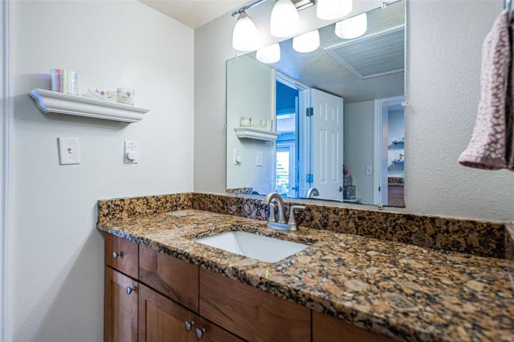 THIS VANITY AREA is a GAME CHANGER in a 1 Bed/ 1 Bath Condo! There are 2 Doors to Enter-1 from the Kitchen (for guests) & 1 from the Bedroom for Owner- It doubles as an En Suite & Guest Bath. In Many 1 Bed/ 1 Bath Units, You Have to Walk Thru the Bedroom, to Get to the Bathroom