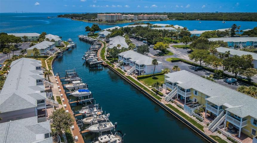 YOUR WATERFRONT PATIO is the Lower Level, 2nd 1 down, in Yellow Building on Right side. Looking S at Skyway Bridge in the Distance