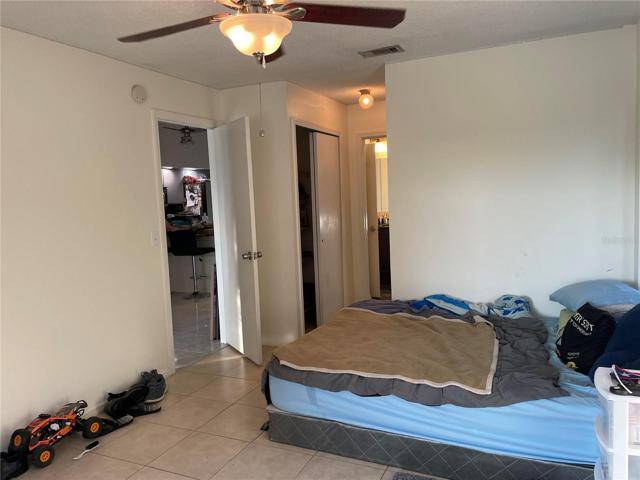 Guest bedroom with two closets and access to bathroom