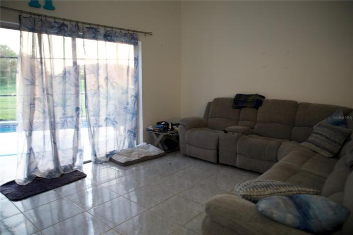 Living room with access to pool deck