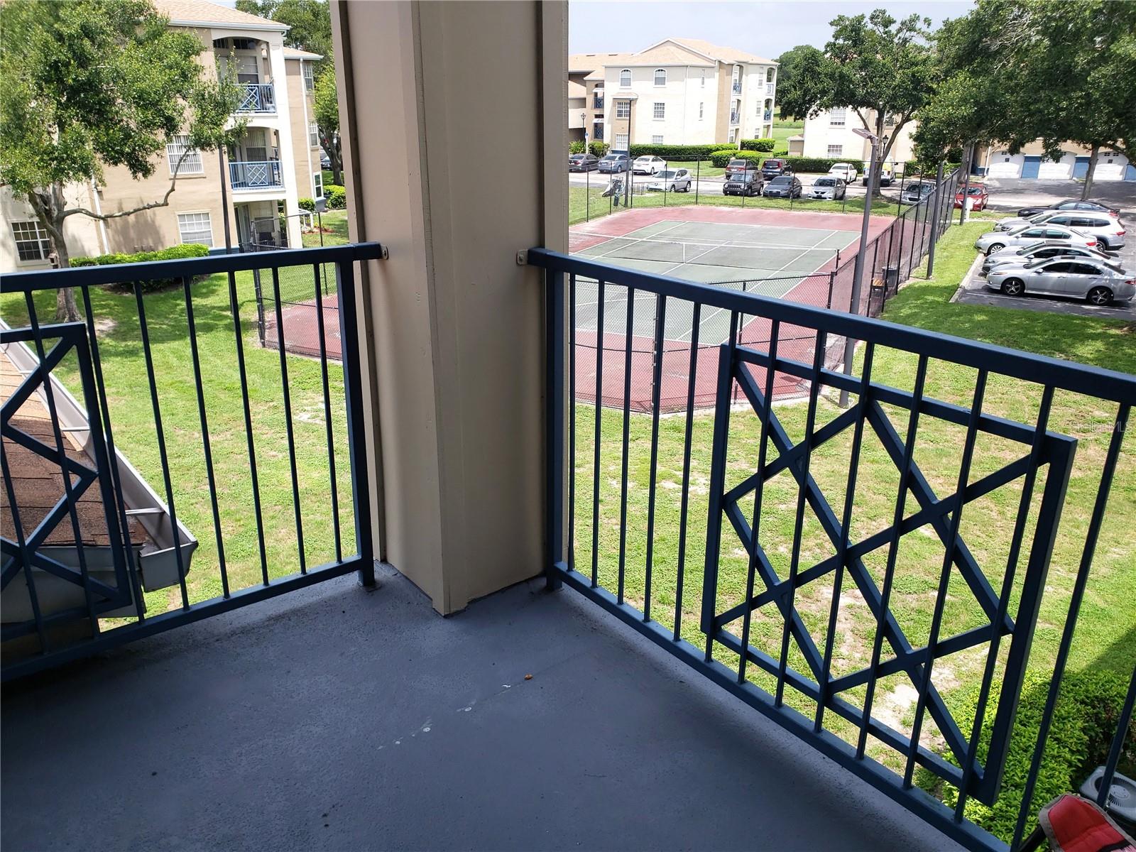 Covered Patio which looks out on Tennis Court