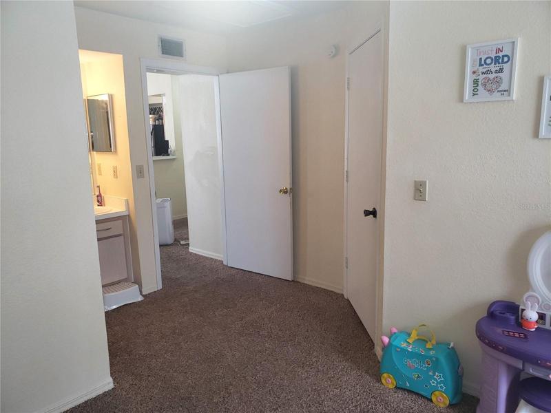 Second Bedroom Walk-in Closet; Dressing area; Ensuite Bathroom on Left.