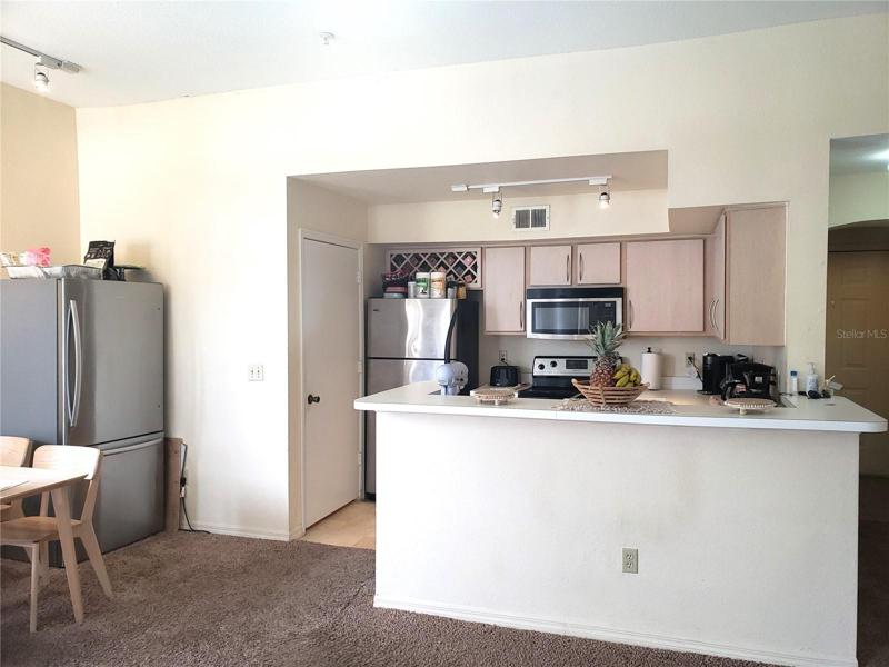 Kitchen; Door to Utility Room on Left; Hallway to Front Door on Right