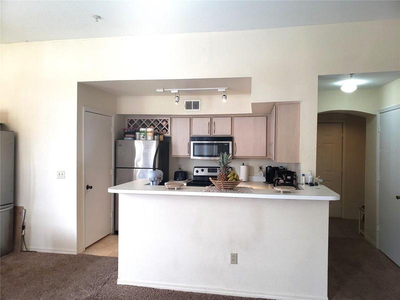 Kitchen; Utility Room on Left; Coat Closet in Hallway on Right