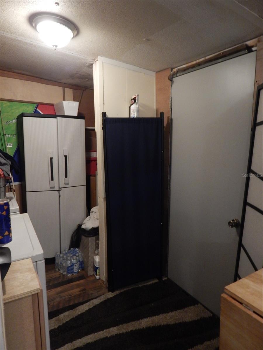 Laundry room with door to backyard