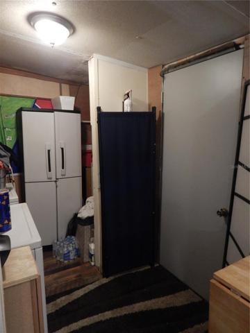 Laundry room with door to backyard
