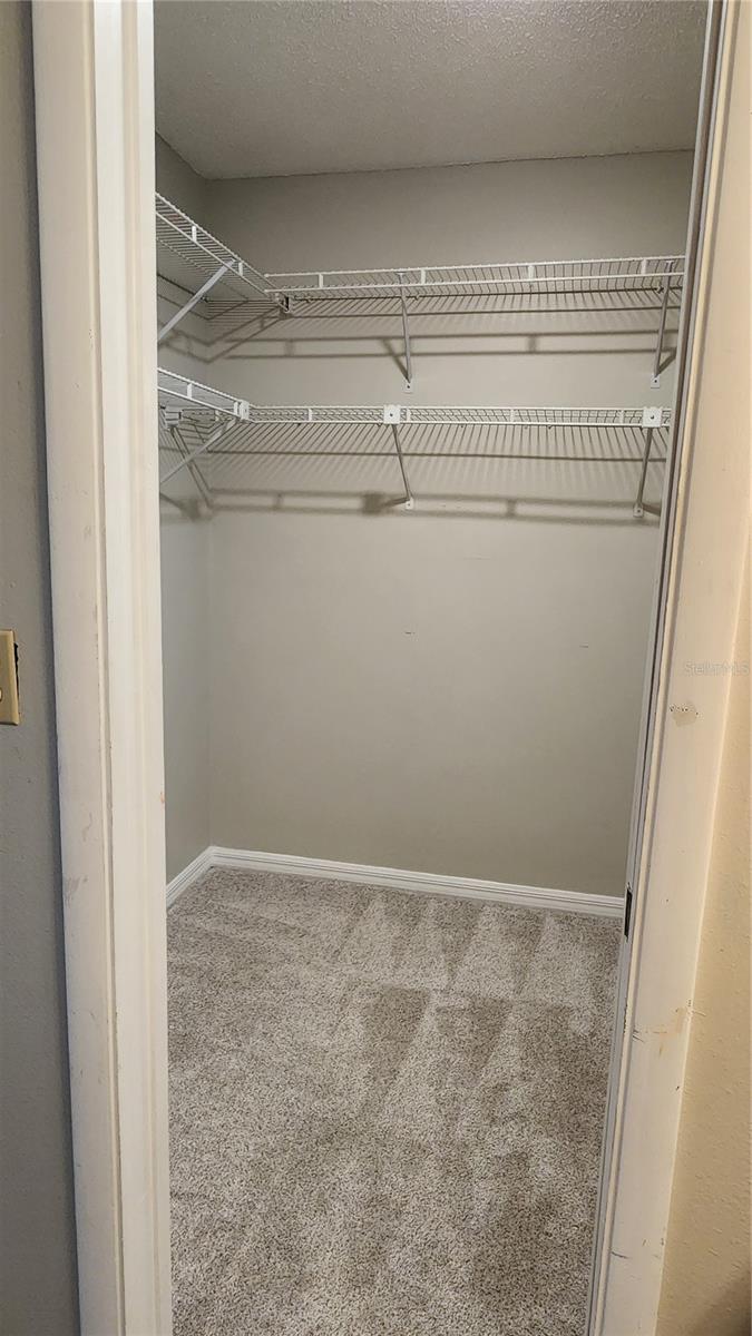Walk in closet in largest bedroom