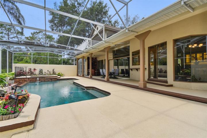 Large covered lanai with custom built tiki bar