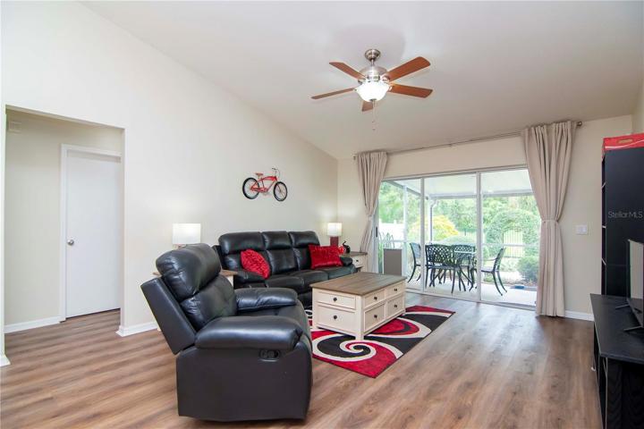 Living room overlooking the sliding glass doors & conservation area