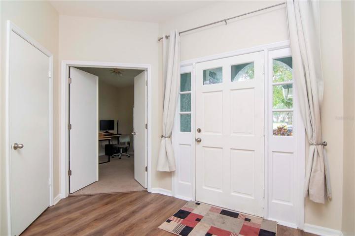 entrance w/ bedroom 4 being used as front office room