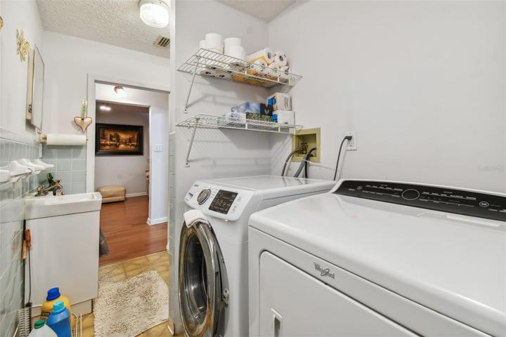 Hall Bathroom with washer and dryer.