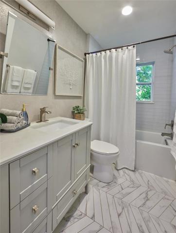 Bath to the right side of the house. Window in this bathroom looks out over the back yard.