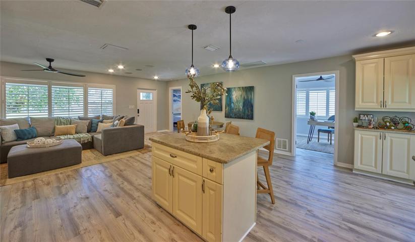 From this space you can see the suite to the left and the 4th bedroom / office to the right. The laundry room and side entrance are in between the suite and the room to the right.