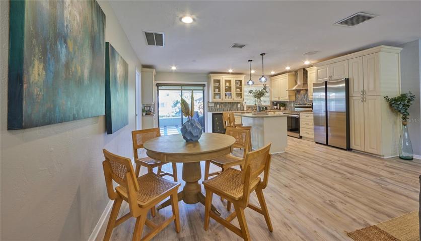 From entry, your home looks out into the canal, screened in lanai and the lush garden back yard.