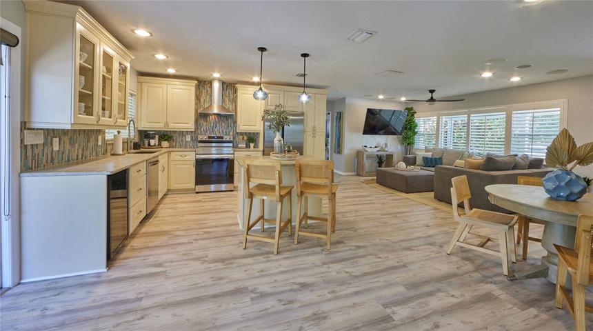 Spacious wide-open living with whole new luxury vinal plank flooring just installed.