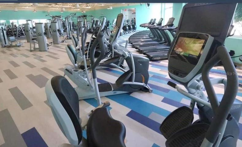 fitness center, with sauna, showers, and entrance to in door pool, with whirlpool.