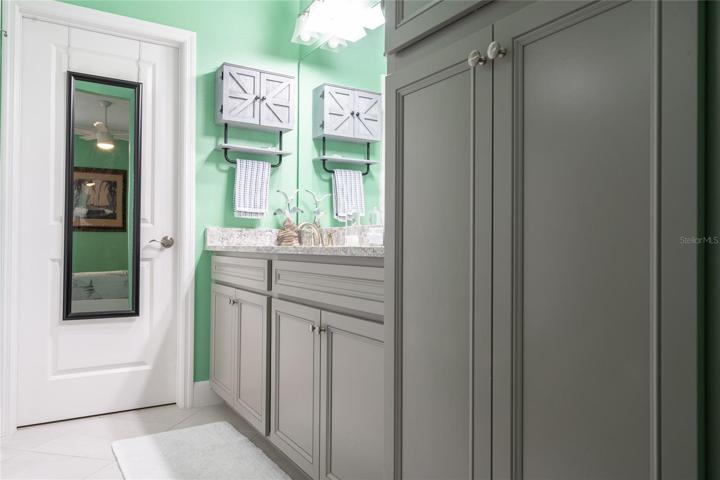 master bath with lots of cabinets.