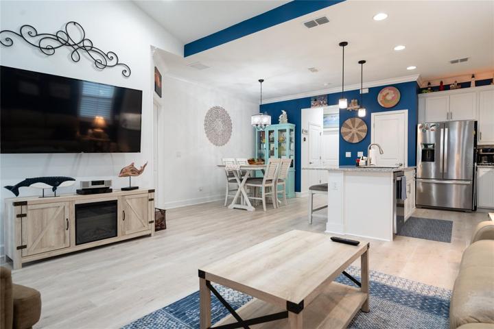 living room with open view of dining room and kitchen