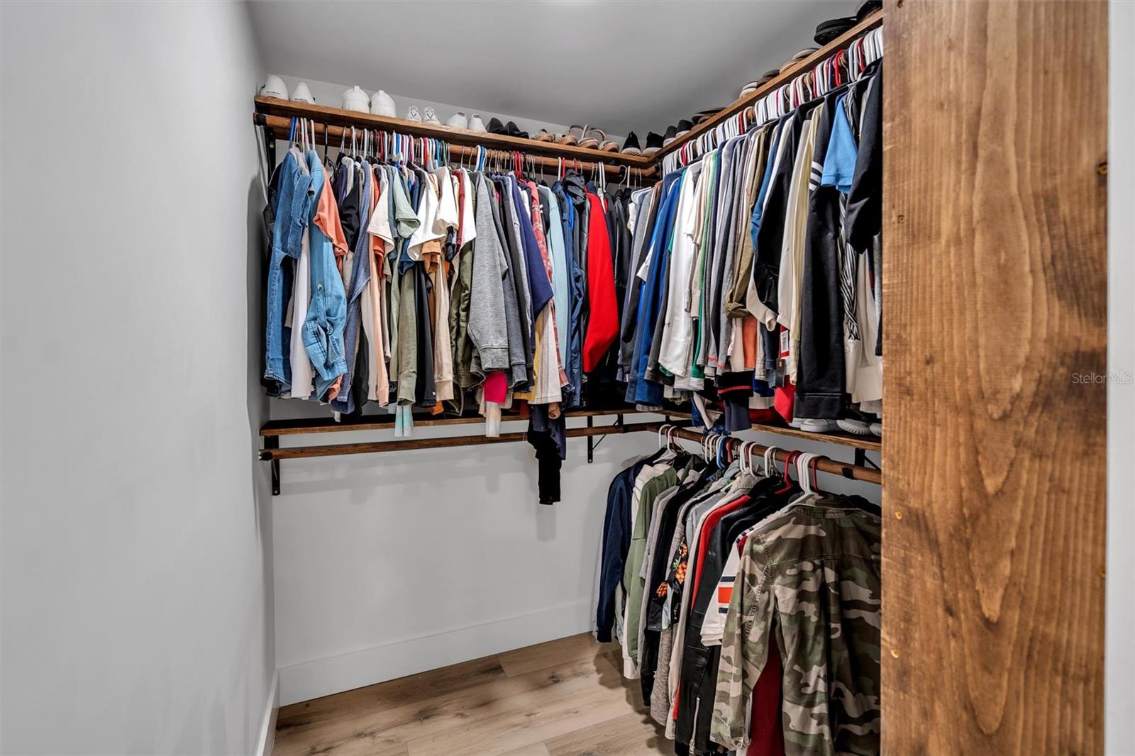 Master walk-in closet with custom shelving system