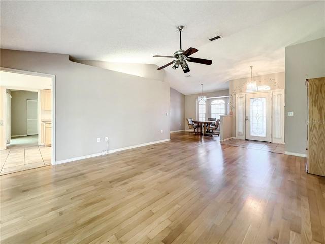 Living Room with hardwood floors & high ceilings