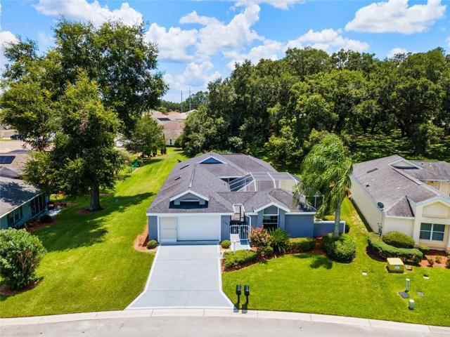 FRONT EXTERIOR (low aerial view) of MARK V VILLA - 11522 SE 178th Lane, Summerfield, FL in STONECREST