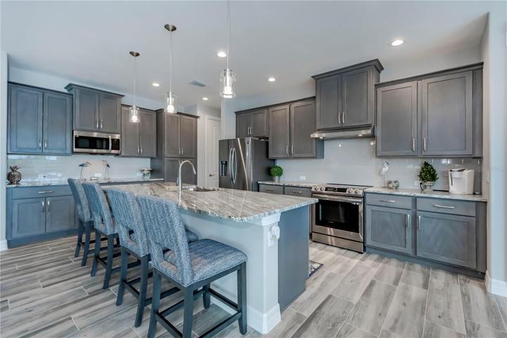 chef sized kitchen with island breakfast bar