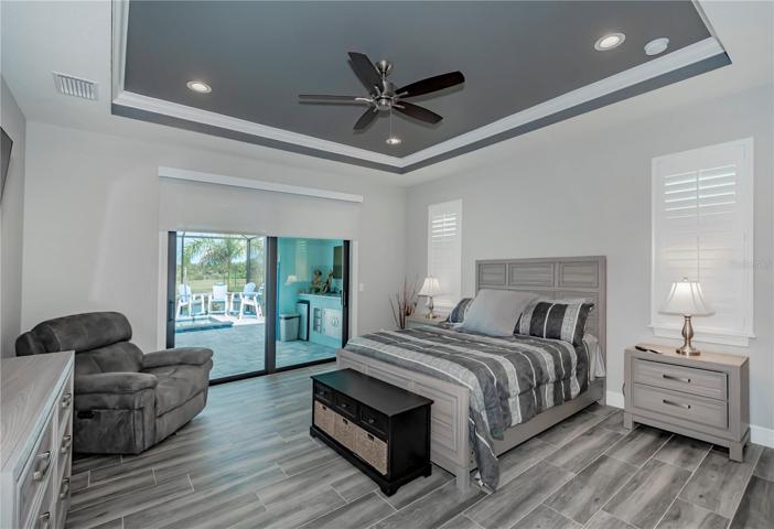 master bedroom with pool access and ensuite bath