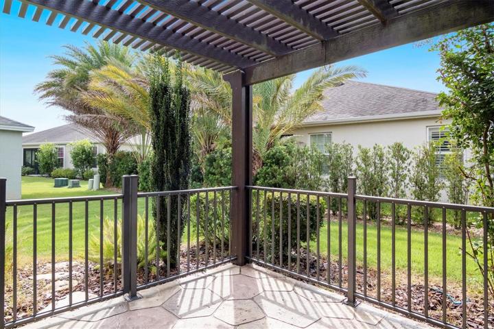 OUTSIDE PATIO WITH PERGOLA OVERHEAD.  ENJOY THE OUTSIDE SPACE