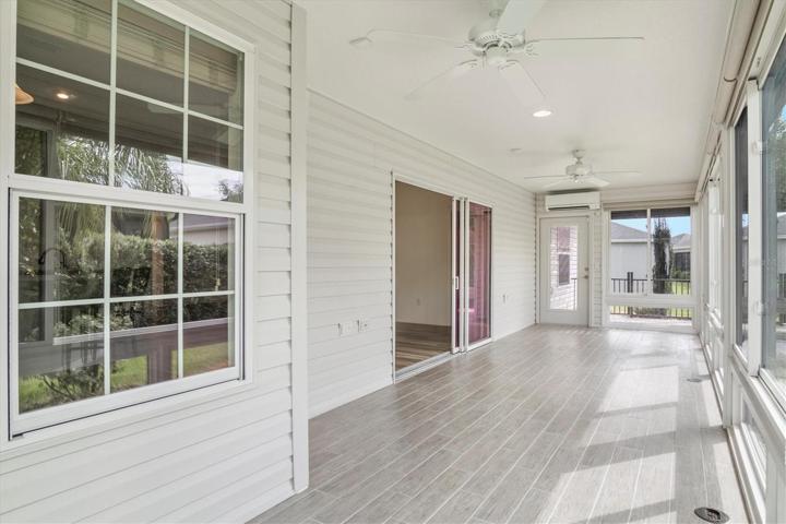 LARGE FLORIDA ROOM WITH ROLL DOWN SHADES ON ALL WINDOWS AND EVEN ELECTRIC OUTLETS IN FLOOR FOR YOUR LAMPS, TV ETC